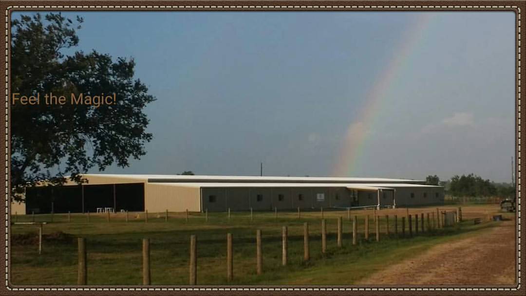 The Morning Glory Ranch facility with a rainbow overhead