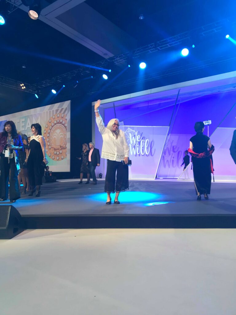 Kim Russell recognized on stage for her Nu Skin leadership